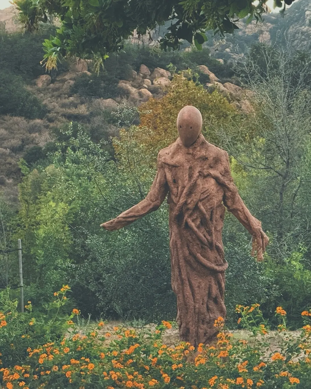 A human-like Tears of Nature sculpture with branching forms